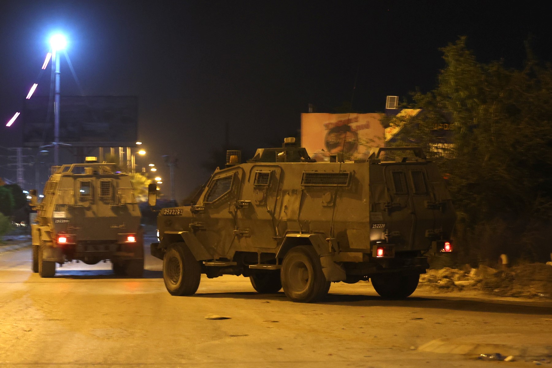 File Photo of armored Israeli forces roaming West Bank (AFP)