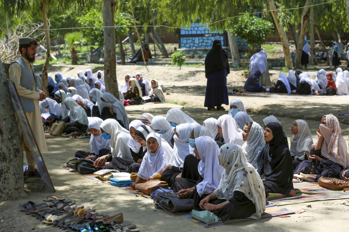 Afghan school girls attend a class at an open air primary school in Jalalabad on May 7, 2023. (AFP)