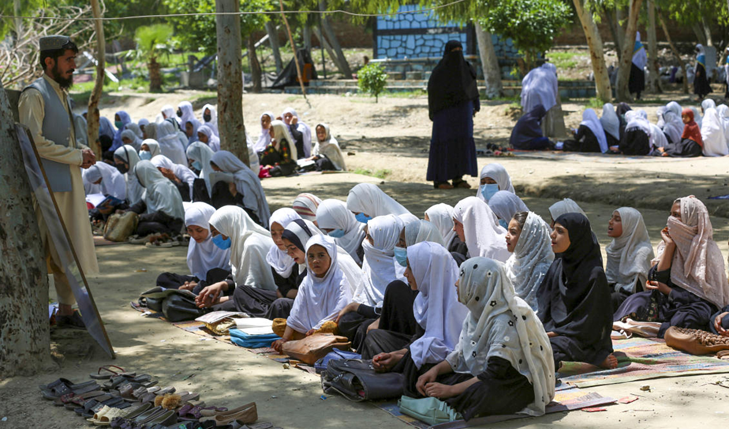 Afghan school girls attend a class at an open air primary school in Jalalabad on May 7, 2023. (AFP)