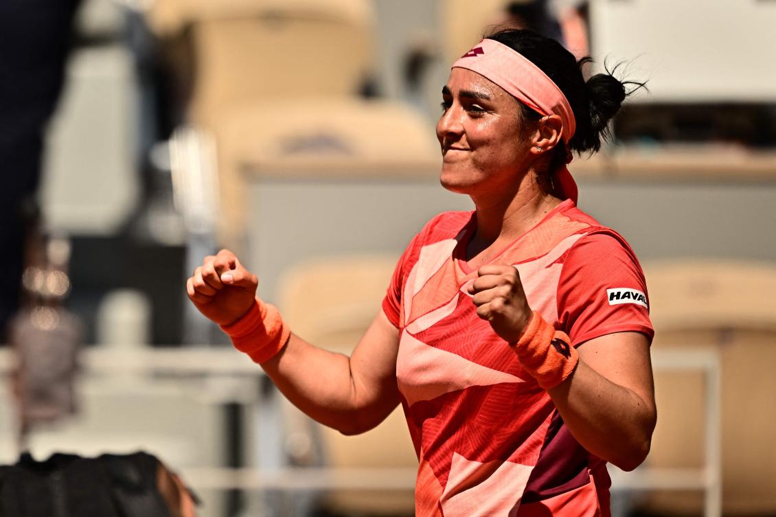 Tunisia’s Ons Jabeur celebrates after winning against US Bernarda Pera at the end of their women’s singles match on day nine of the Roland-Garros Open tennis tournament at the Court Philippe-Chatrier in Paris on June 5, 2023. (AFP)