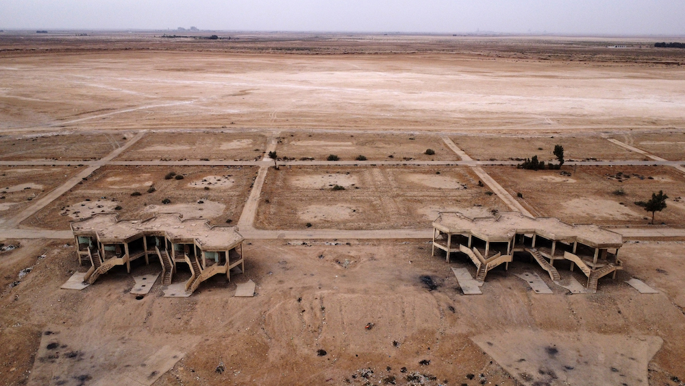 Above, abandoned hotels and tourist facilities in Iraq’s Sawa Lake, completely dry due to climate change and rising temperature, in the country’s southern province of Al-Muthanna on April 19, 2022. (AFP)