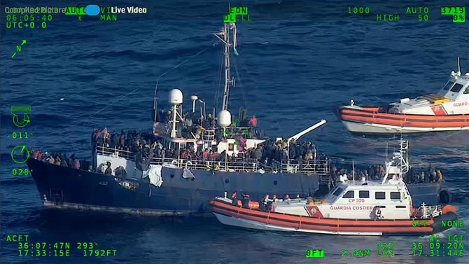 An ongoing rescue operation, coordinated by the Coast Guard's National Maritime Rescue Centre, at a fishing boat with about 800 migrants onboard, intercepted 190 kilometres south-east of Syracuse, in Italian waters. (AFP/File)