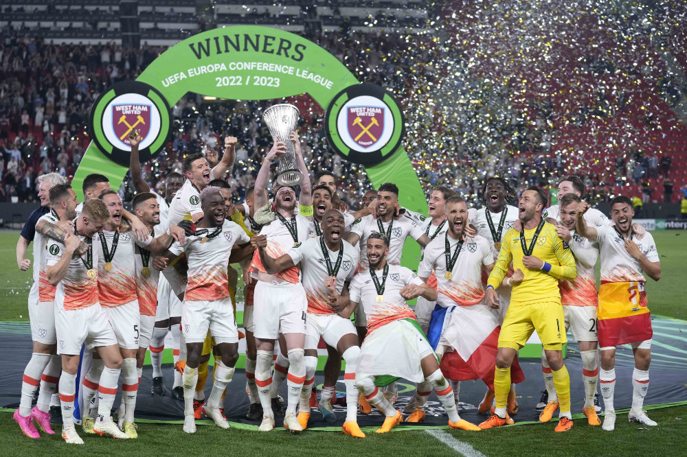 West Ham players celebrates with the trophy after winning the Europa Conference League final against Fiorentina at the Eden Arena in Prague. (AP)