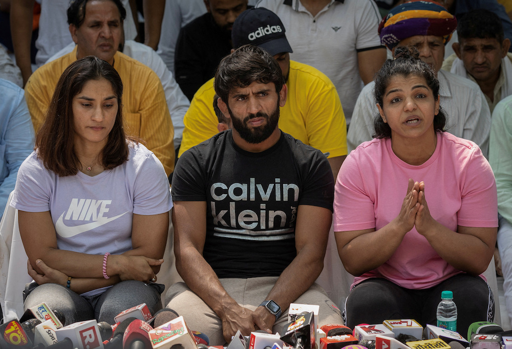 In this April 23 file photo Indian wrestlers Vinesh Phogat, Bajrang Punia, and Sakshi Malik address a news conference in a sit-in protest demanding arrest of Wrestling Federation of India (WFI) chief, who they accuse of sexually harassing female players. (File/ Reuters)