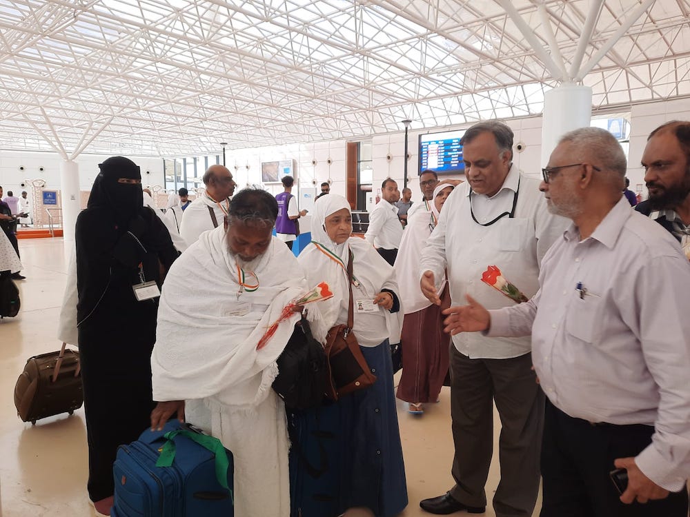 Indian ambassador Suhel Ajaz Khan welcomes Hajj pilgrims arriving in Jeddah airport on June 7, 2023. (Indian Embassy in Riyadh)