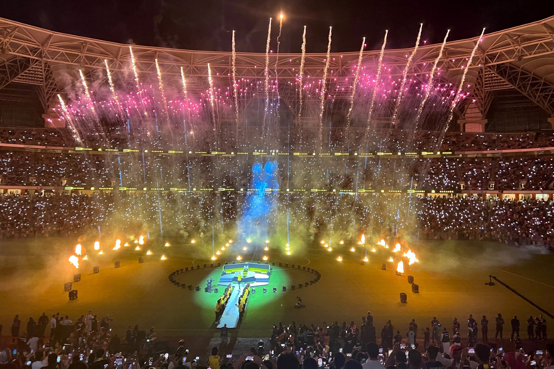 Fans watch fireworks at Al-Ittihad's stadium in Jeddah during a ceremony to unveil former Real Madrid striker Karim Benzema, on June 8, 2023. Benzema was unveiled as an Al-Ittihad player in front of thousands of fans in Saudi Arabia (AFP)