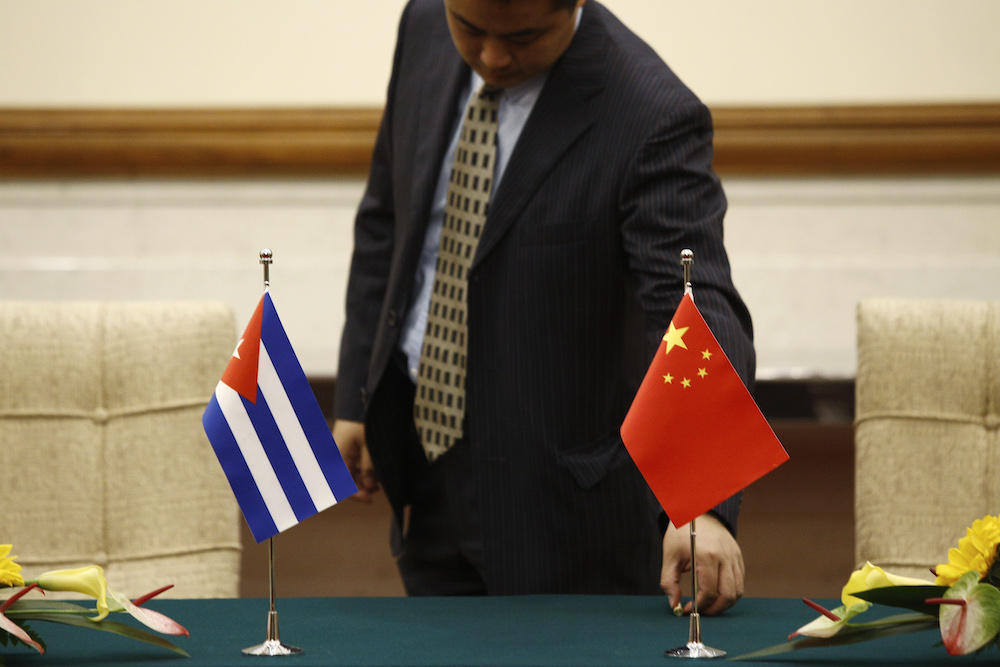 A staff prepares a table before a meeting between Cuban foreign minister Bruno Rodriguez and his Chinese counterpart Wang Yi at Diaoyutai state guesthouse in Beijing on May 29, 2019. (AFP file photo)