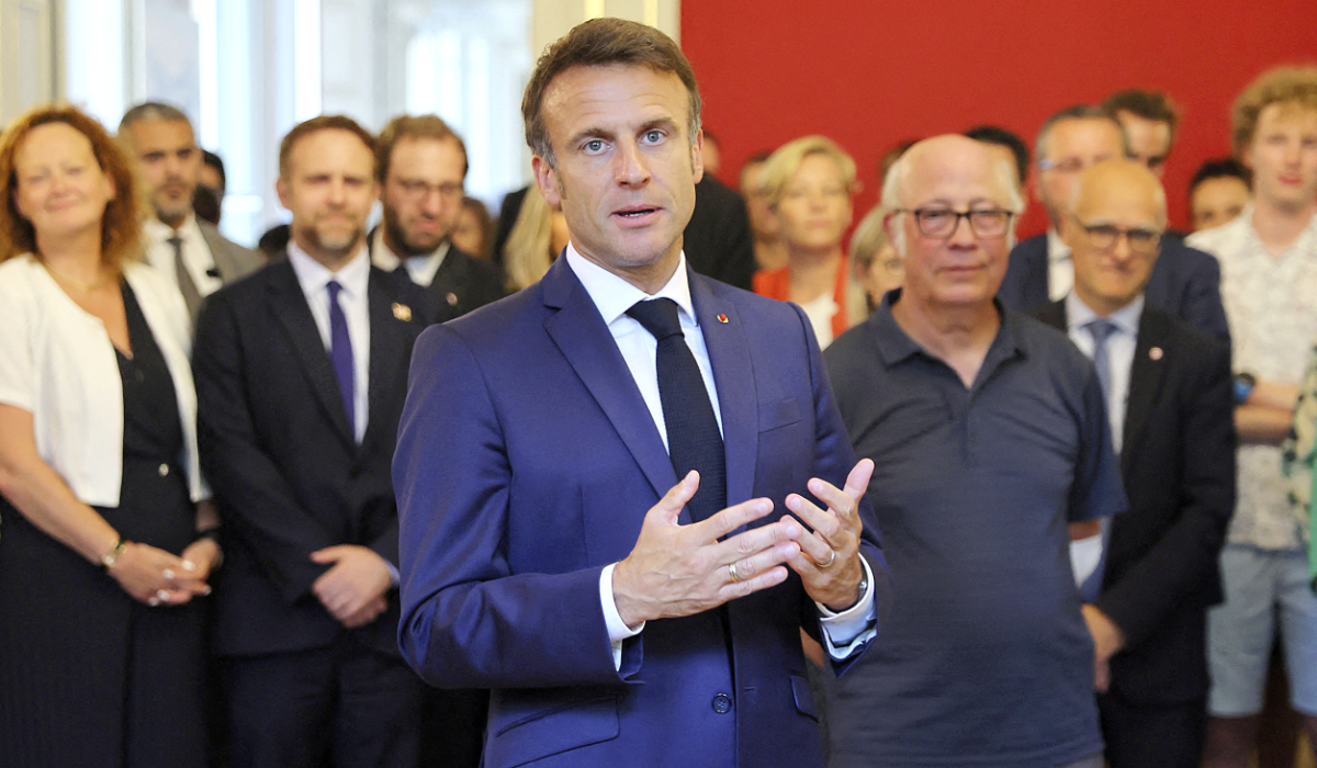President Emmanuel Macron delivers a speech on Friday as he meets rescue forces a day after a mass stabbing in a park in Annecy, French Alps. (AP)