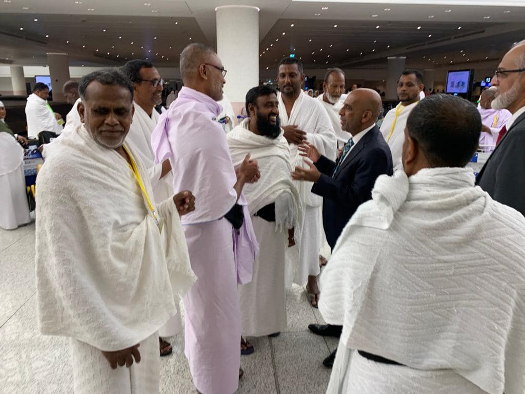Sri Lankan Ambassador Pakeer Mohideen Amza and Consul General Falah Alhabshi Mowlana greet Hajj pilgrims arriving in Jeddah from Colombo on June 4, 2023. (Sri Lanka Embassy in Saudi Arabia)
