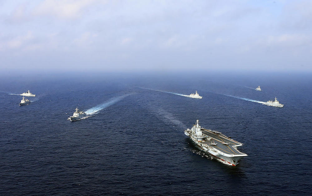 China’s aircraft carrier the Liaoning, front, sails with other ships during a drill at sea in April 2018. This week’s military exercises include live-fire from warships. (AFP file photo)