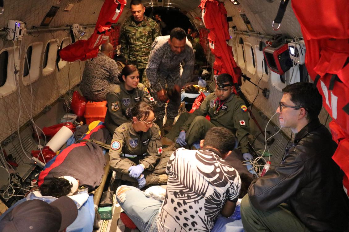 Colombian army personnel check on the four indigenous children who were found alive after being lost for 40 days during their transfer to Bogota. (Colombian Air Force/AFP)