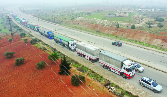 Trucks from the World Food Programme drive through the Syrian city of Idlib. (AFP/File)
