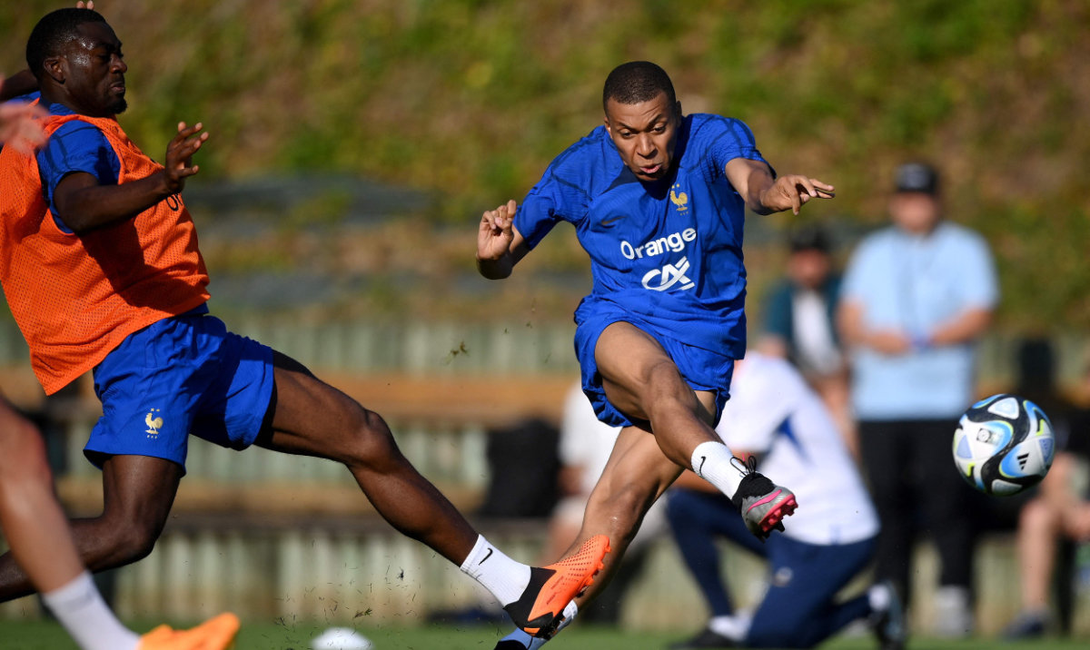 France's forward Kylian Mbappe shoots the ball during a training session in Clairefontaine-en-Yvelines on Tuesday, as part of the team's preparations for the upcoming UEFA Euro 2024 football tournament qualifying matches. (AFP)