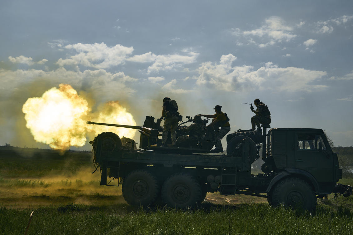 Ukrainian soldiers fire a cannon near Bakhmut on May 15, 2023. (AP/File)