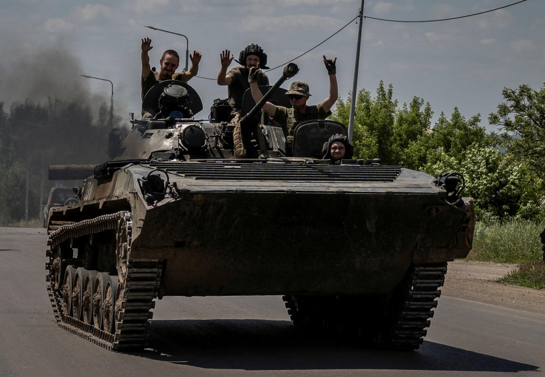 Ukrainian service members ride a BMP-1 infantry fighting vehicle, amid Russia’s attack on Ukraine, in Donetsk region on Jun. 9, 2023. (Reuters)
