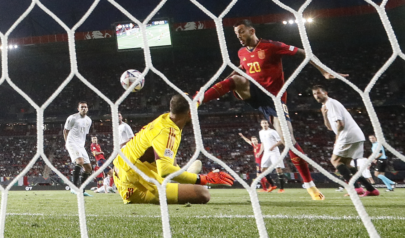 Spain's Joselu scores the decisive last goal against Italy goalkeeper Gianluigi Donnarumma during the Nations League semifinal between Spain and Italy in Enschede, Netherlands, Thursday. (AP)