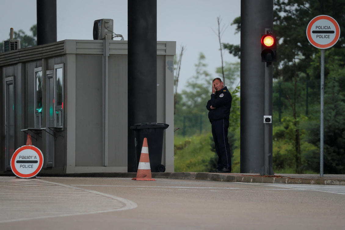 A Kosovo police officer stands at the Kosovo-Serbia border crossing in Merdare, Kosovo, June 15, 2023. (Reuters)