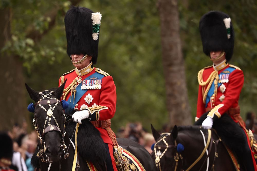 Britain’s King Charles III, left, leads Prince William on horseback on The Mall for the King’s Birthday Parade in London on June 17, 2023. (AFP)