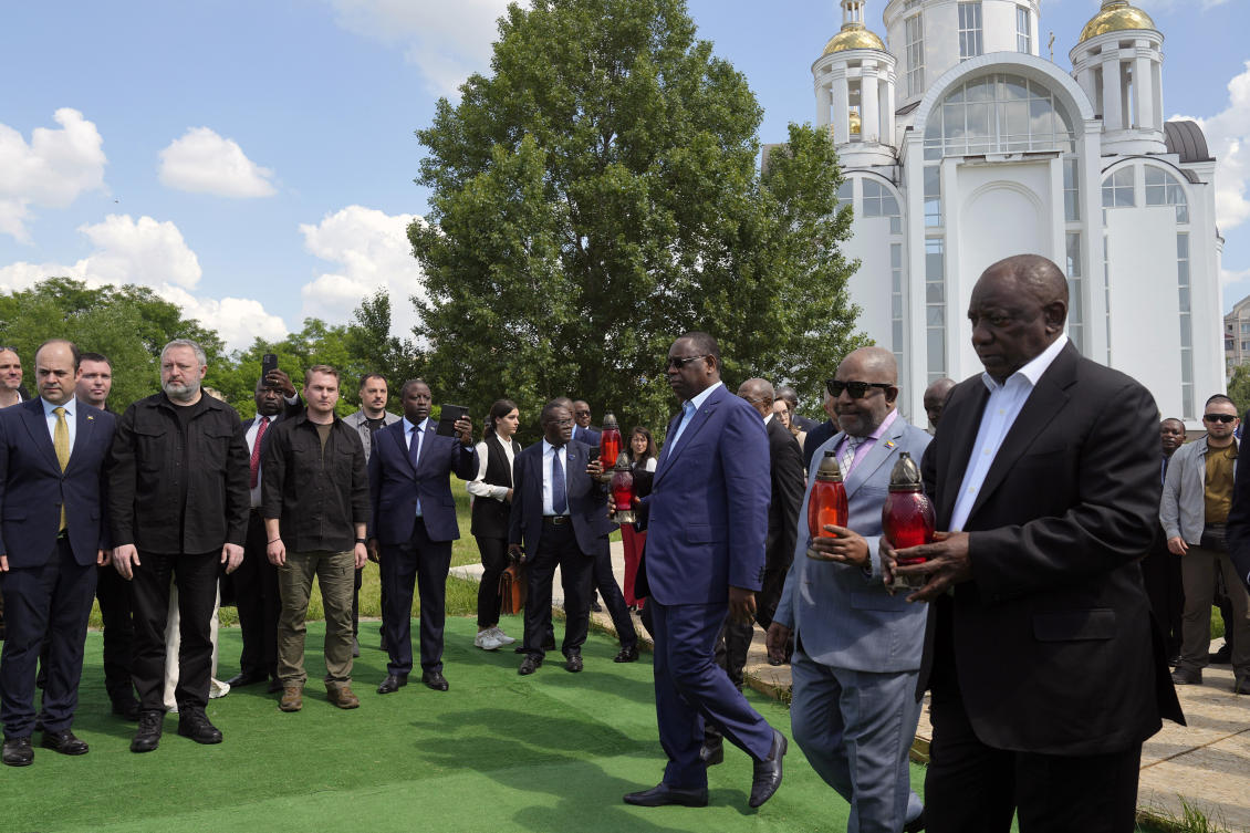 From right, South African President Cyril Ramaphosa, President of the Union of Comoros Azali Assoumani and Senegal’s President Macky Sall attend a commemoration ceremony at a site of a mass grave in Bucha, on the outskirts of Kyiv, on Jun. 16, 2023. (AP)