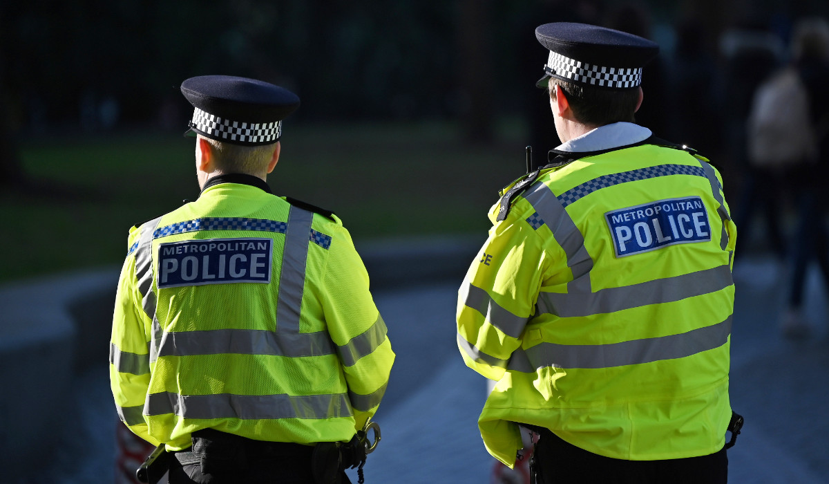 Police officers stand guard in central London, on January 21, 2023. (AFP)