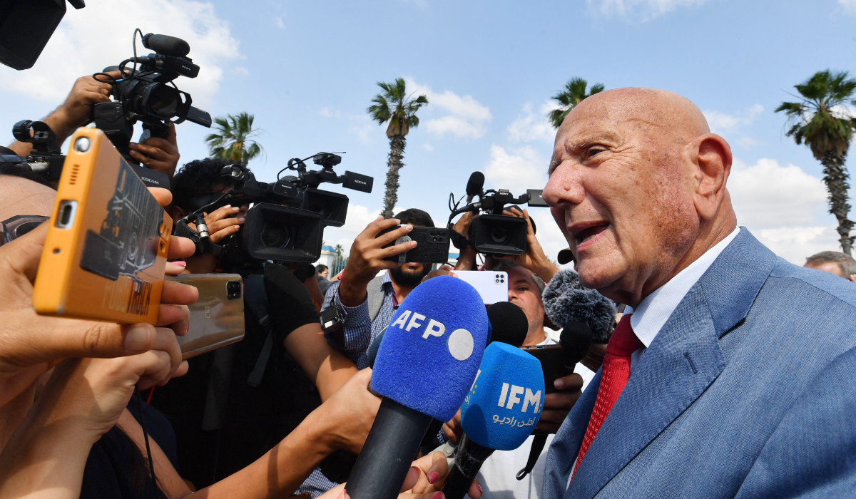 Ahmed Nejib Chebbi (R), leader of Tunisia's opposition National Salvation Front party, talks to the media as he arrives at the offices of Tunisia's counter-terrorism prosecutor in Tunis, on June 16, 2023. (AFP)
