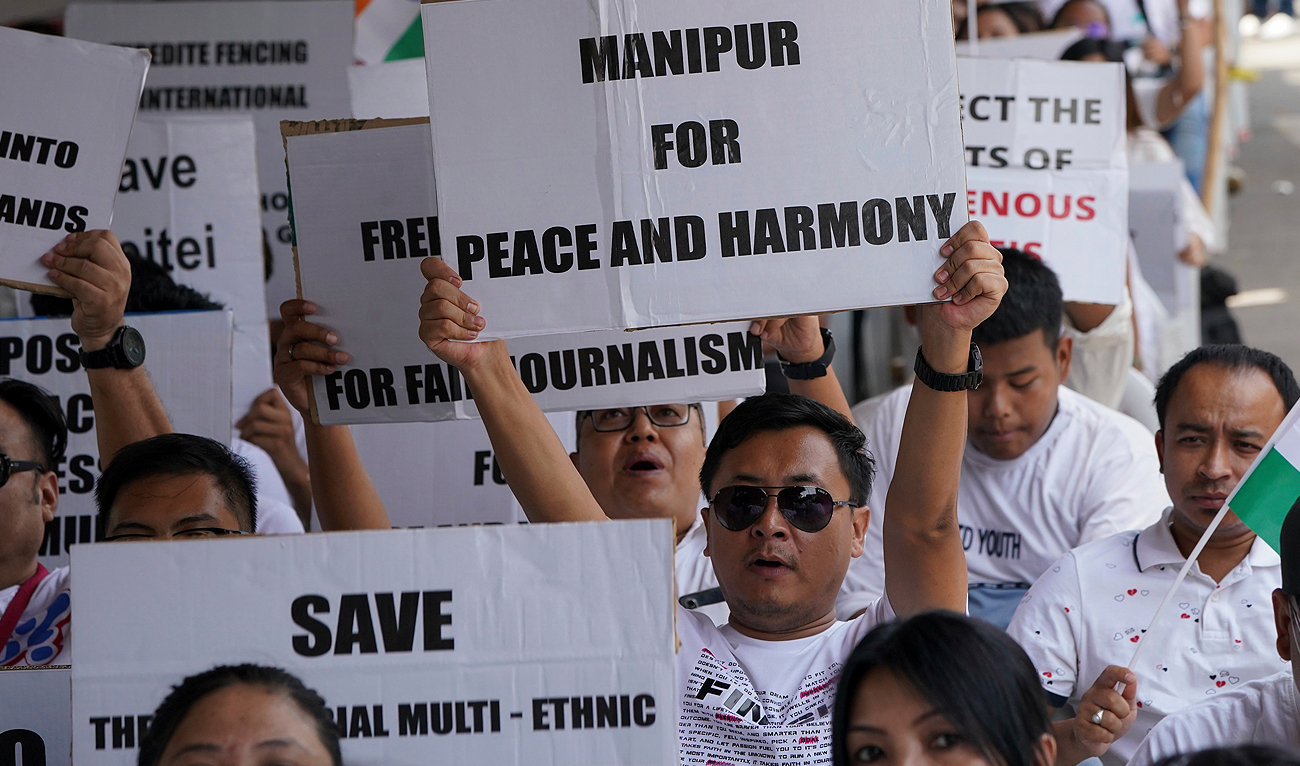 Members of the Hyderabad Manipur Society holding placards condemning violence in their home state gather in Hyderabad, India, Sunday, June 18, 2023. (AP)