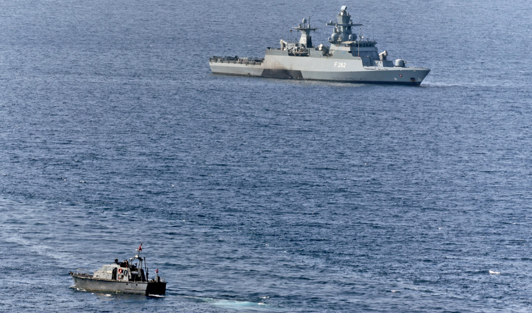 A navy patrol boat sails near the German Navy corvette FGS Erfurt (F262) in the Mediterranean sea waters off Lebanon's southern Naqoura on October 27, 2022. (AFP/File)