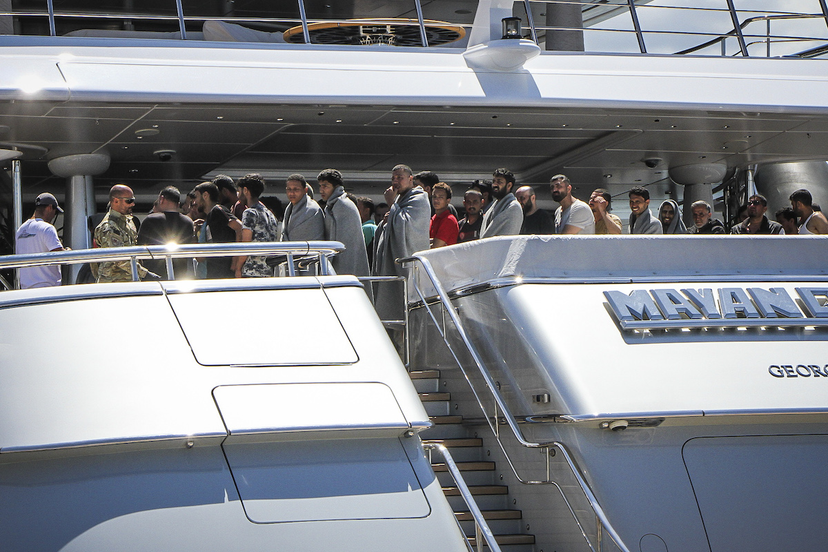Survivors arrive to the port of Kalamata, after a boat carrying dozens of migrants sank in international waters in the Ionian Sea. (File/AFP)