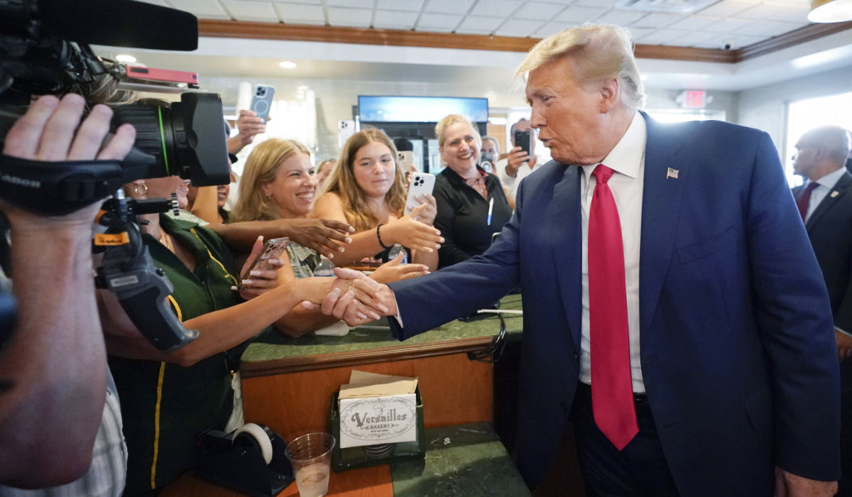 Former President Donald Trump greets supporters at Versailles restaurant on Tuesday, June 13, 2023, in Miami. (AP)