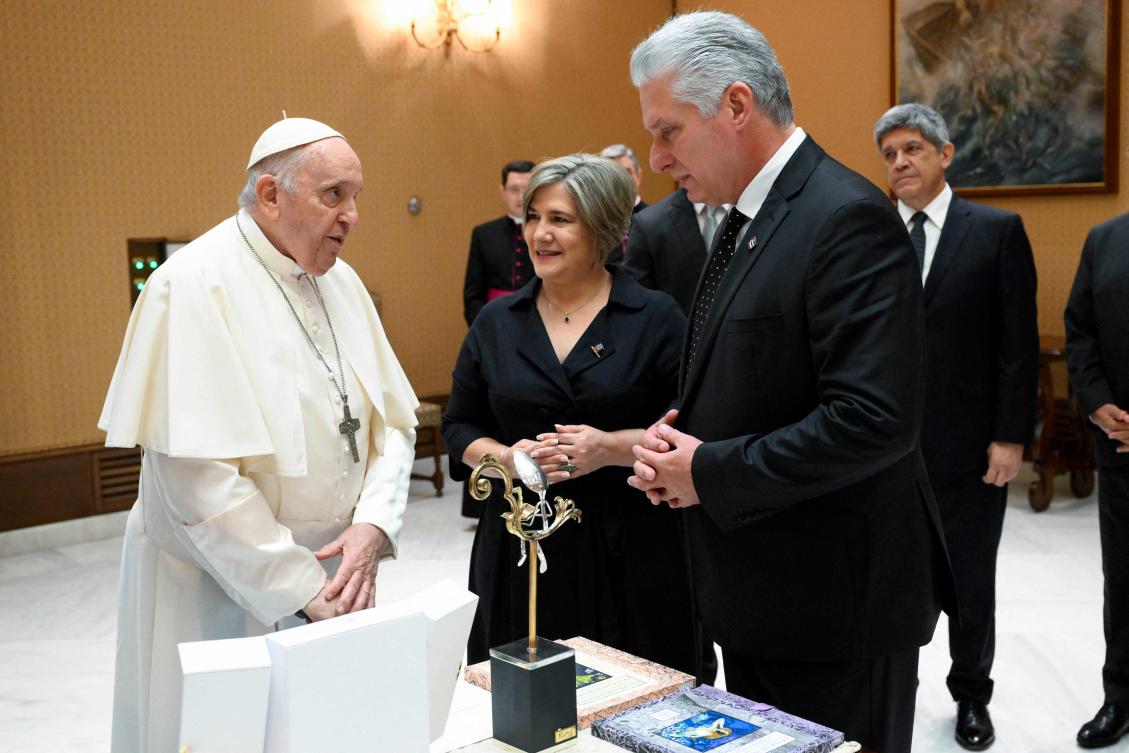 This handout photo taken on June 20, 2023 and released by the Vatican press office, Vatican Media shows Pope Francis, left, welcomes President of Cuba Miguel Diaz-Canel and his wife Lis Cuesta Peraza prior to their meeting at the Vatican on June 20, 2023. (Vatican Media/AFP)