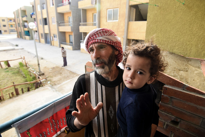Syrian Mohamed Amin who fled his country with his family due to the war, in his apartment Cairo. (AFP/File)