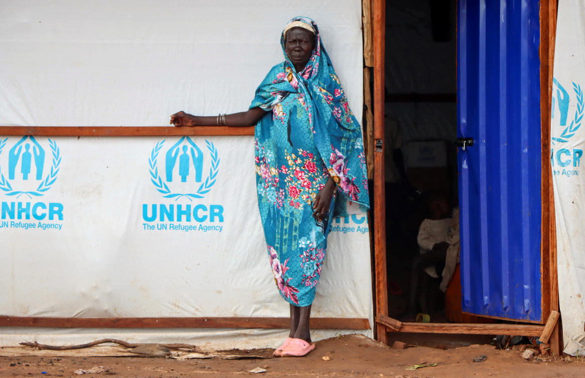 A Sudanese refugee woman stands outside a shelter at the Gorom Refugee camp hosting Sudanese refugees. (Reuters)