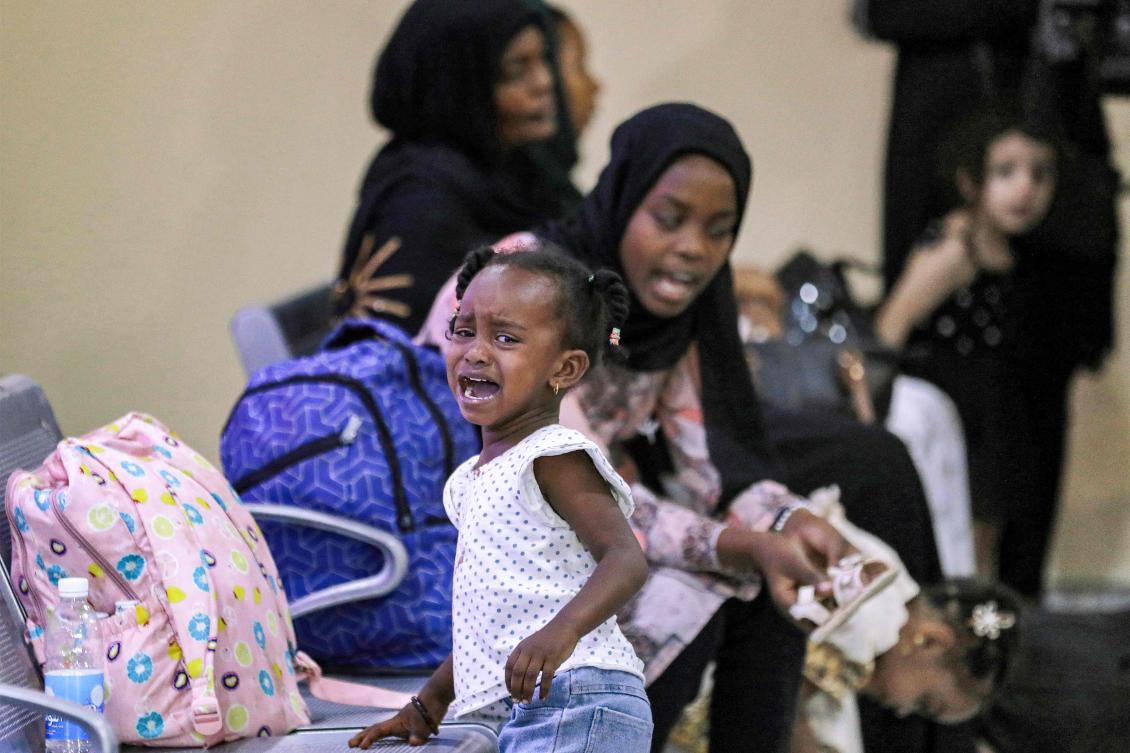 Evacuees from Sudan wait upon arrival at Baghdad International Airport on June 18, 2023. (File/AFP)