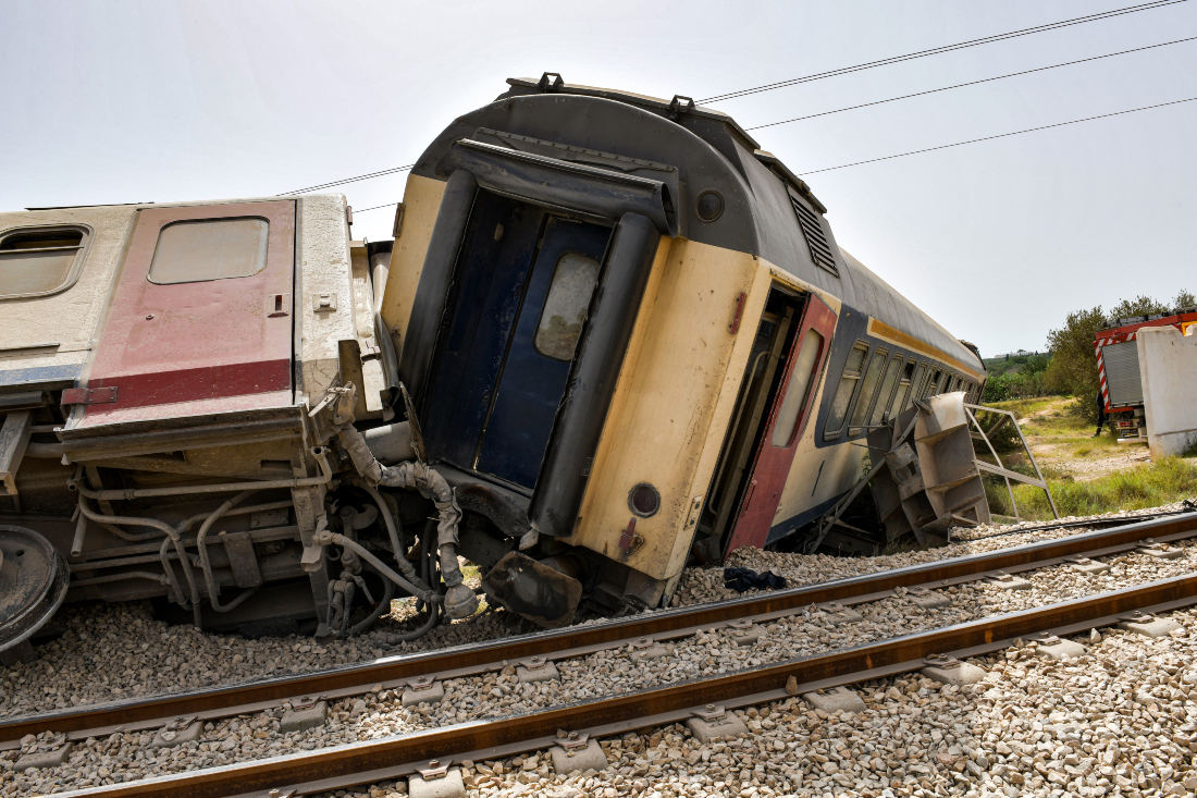 Derailed passenger cars are pictured at the scene of a train accident near Msaken, about 150 kilometres south of the capital in eastern Tunisia. (AFP)