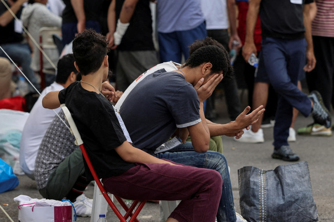 Above, survivors of the deadly shipwreck at open sea off Greece wait to board a bus as they are being transferred to Athens from the port of Kalamata, Greece on June 16, 2023. (Reuters)