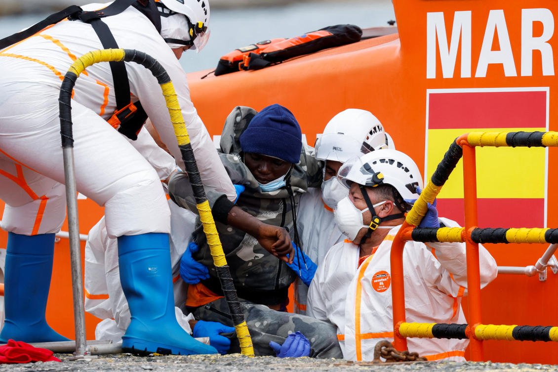 Rescuers help a migrant disembark from a Spanish coast guard boat, at the port of Arguineguin, in the island of Gran Canaria, on June 19, 2023. (Reuters)