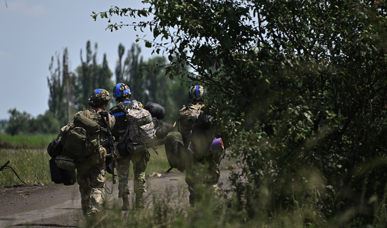 Ukrainian servicemen walk in the recently liberated village of Storozheve in the Donetsk region, on June 21, 2023, amid the Russian invasion of Ukraine. (AFP/File)