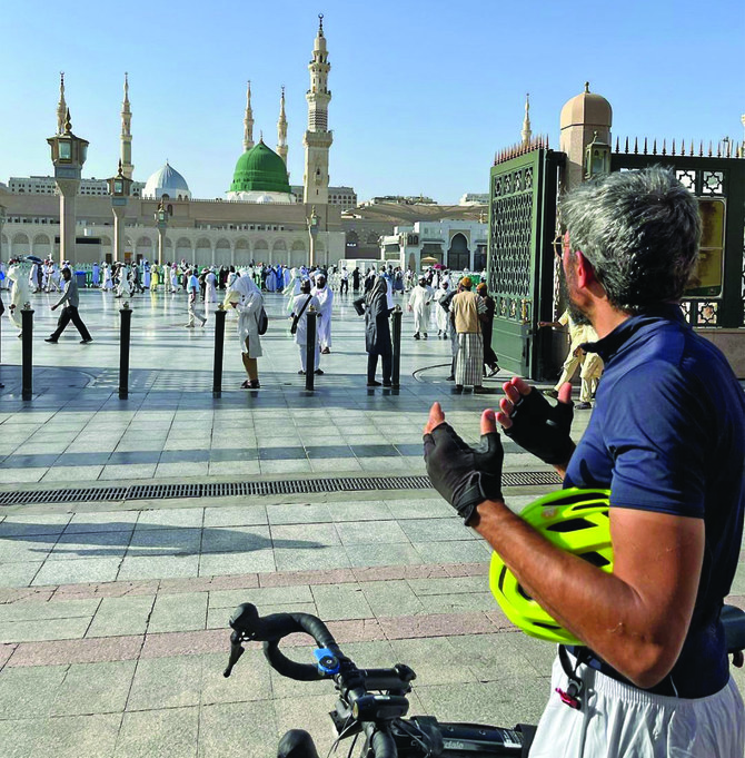 French cyclist Nabil Ennasri at the Prophet’s Mosque in Madinah, after crossing 11 countries on bicycle to perform Hajj this year. (Instagram/nabilennasr)