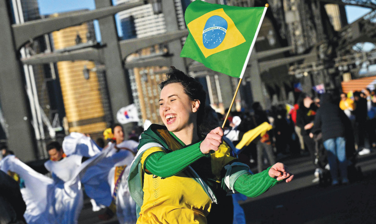 Fans take part in celebrations marking the start of the Australia and New Zealand FIFA Women’s World Cup 2023, in Sydney on Sunday. (AFP)