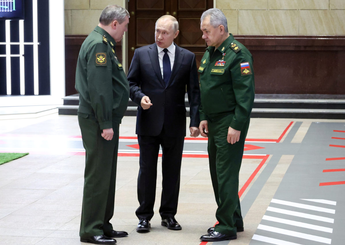 Russian President Vladimir Putin, center, speaks with Chief of the General Staff Gen. Valery Gerasimov, left, and Russian Defense Minister Sergei Shoigu, after a meeting with senior military officers in Moscow, Russia, Wednesday, Dec. 21, 2022. (AP)