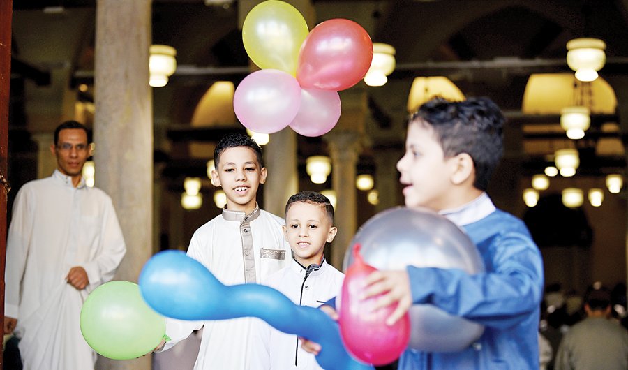 Children play with balloons after Eid Al-Adha prayer inside Al-Azhar Mosque in Cairo, Egypt, in 2021. (Reuters/File)