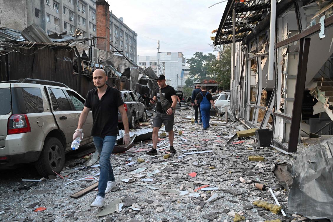 People walk past a restaurant in Kramatorsk, eastern Ukraine, after a missile strike. (AFP)