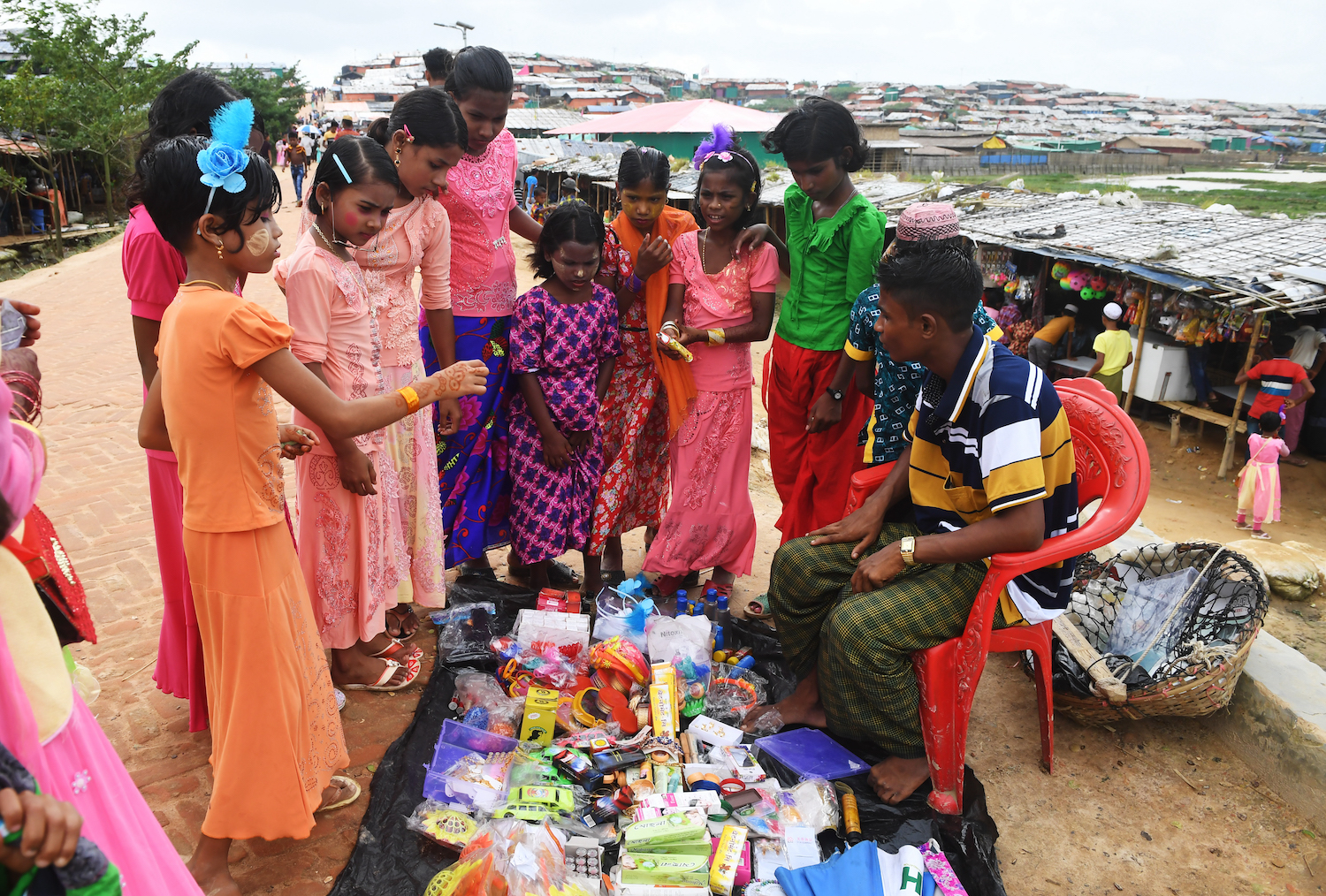 Young Rohingya refugees buy ornaments during the Eid Al-Adha festival at Thangkhali refugee camp in Ukhia district near Cox’s Bazar. (File/AFP)