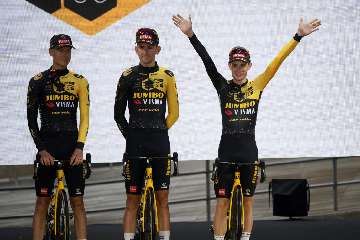 Denmark's Jonas Vingegaard, right, waves during the team presentation ahead of the Tour de France cycling race in Bilbao, Spain, Thursday. The race starts on Saturday with the first stage over 182 kilometers (113 miles) with start and finish in Bilbao. (AP)