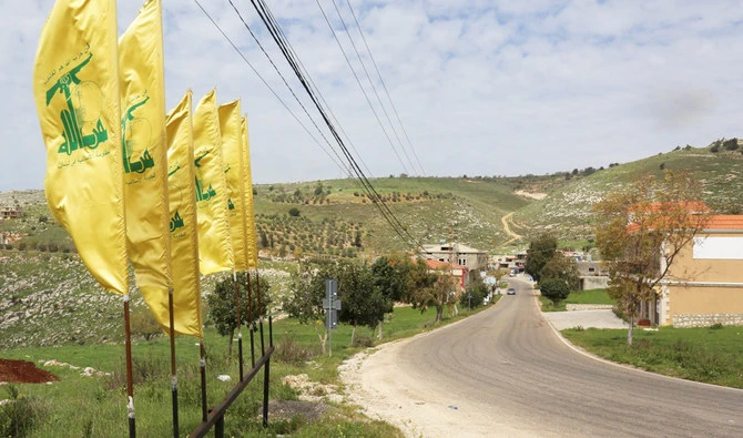 Hezbollah flags flutter at the entrance of Mays Al-Jabal village in Lebanon. (Reuters)