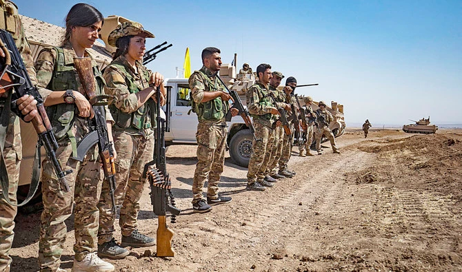 Fighters of Syrian Democratic Forces attend a joint military exercise with forces of the US-led coalition against Daesh. (AFP)