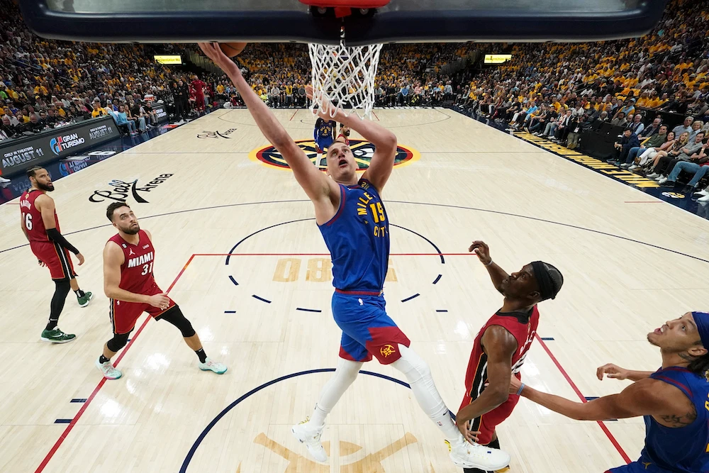 Denver Nuggets center Nikola Jokic, center, shoots against the Miami Heat during the first half of Game 1 of basketball's NBA Finals Thursday in Denver. (AP)