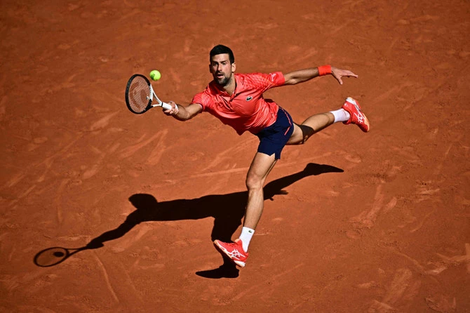 Serbia’s Novak Djokovic plays a forehand return to Spain’s Alejandro Davidovich Fokina during their men’s singles match of the Roland-Garros Open tennis tournament in Paris on Friday. (AFP)