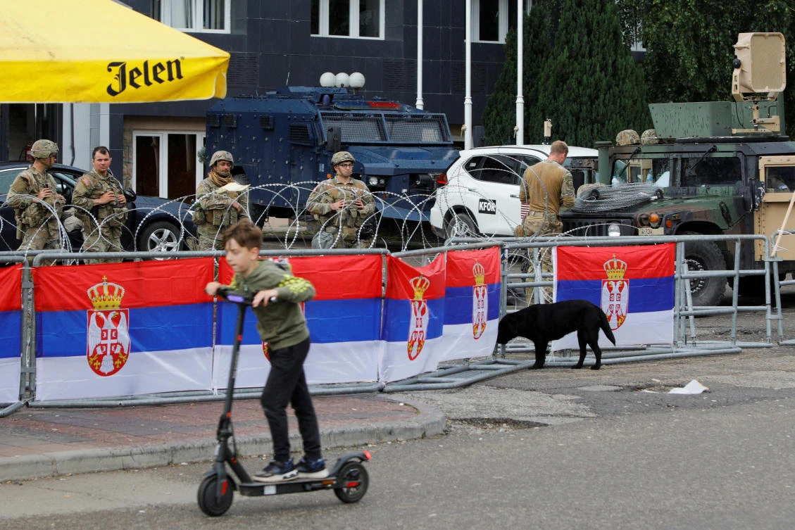 Member of the NATO-led Kosovo Force (KFOR) stand guard near a municipal building in Leposavic, Kosovo, on May 31, 2023. (Reuters)