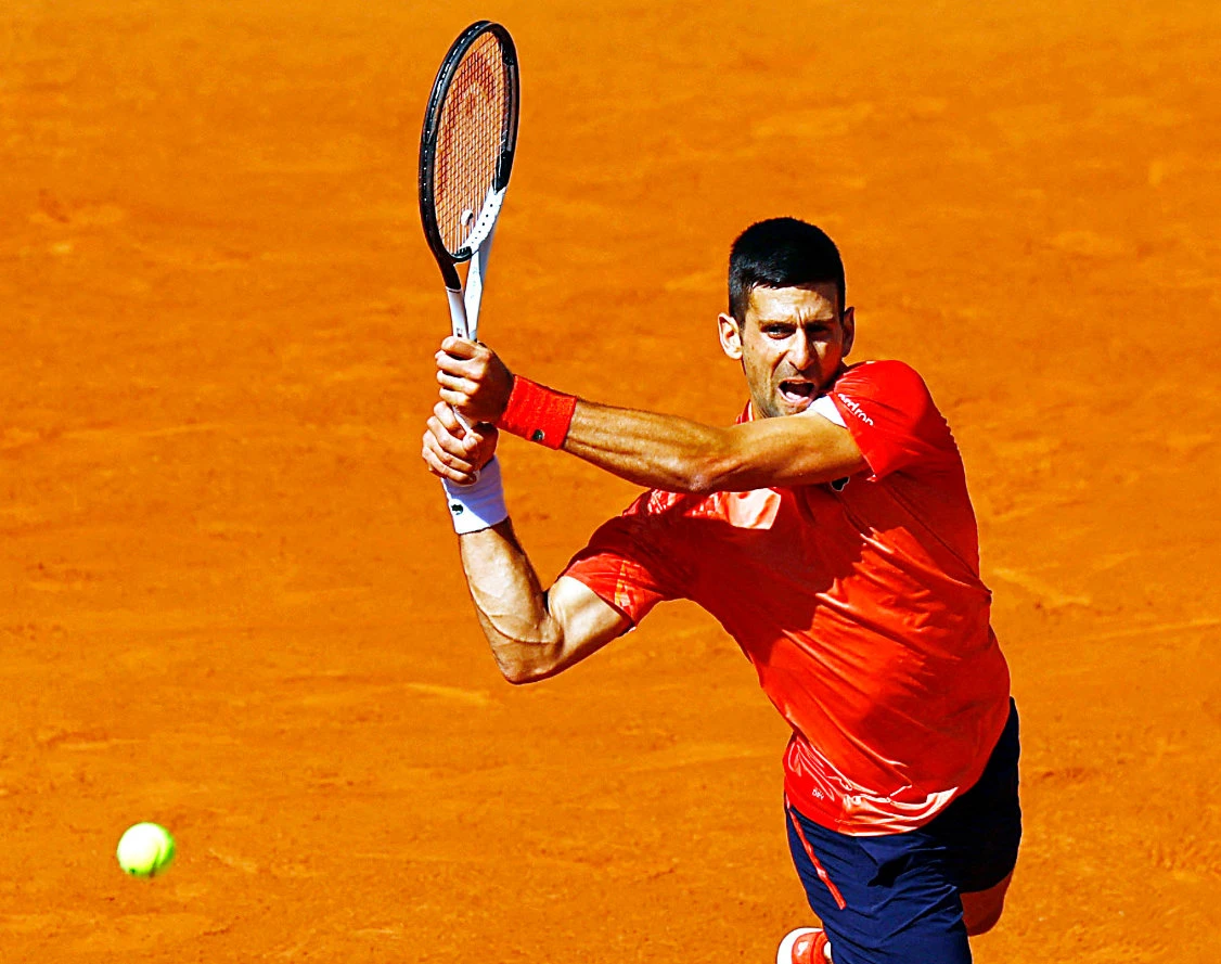 Djokovic, chasing a third Roland Garros championship and record-setting 23rd men’s Grand Slam title, eased past his 94th-ranked Peruvian opponent, 6-3, 6-2, 6-2. (Reuters)